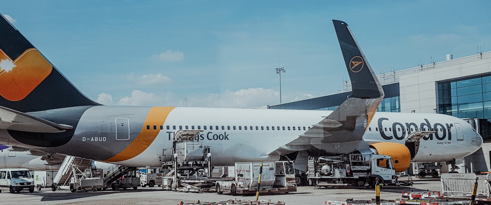 a couple of large airplanes at an airport