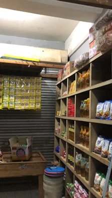 Bags of Gawal Pashu Aahar stacked neatly in a rustic storage room