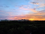 A vibrant sunset over a picturesque travel destination.