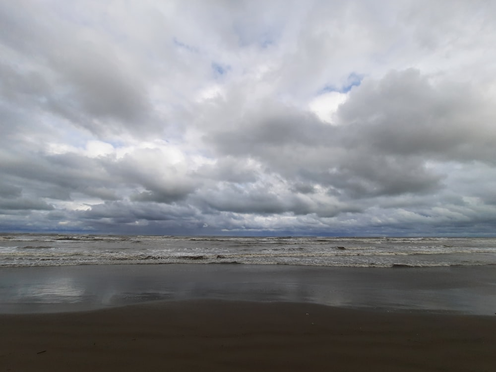 a beach with clouds