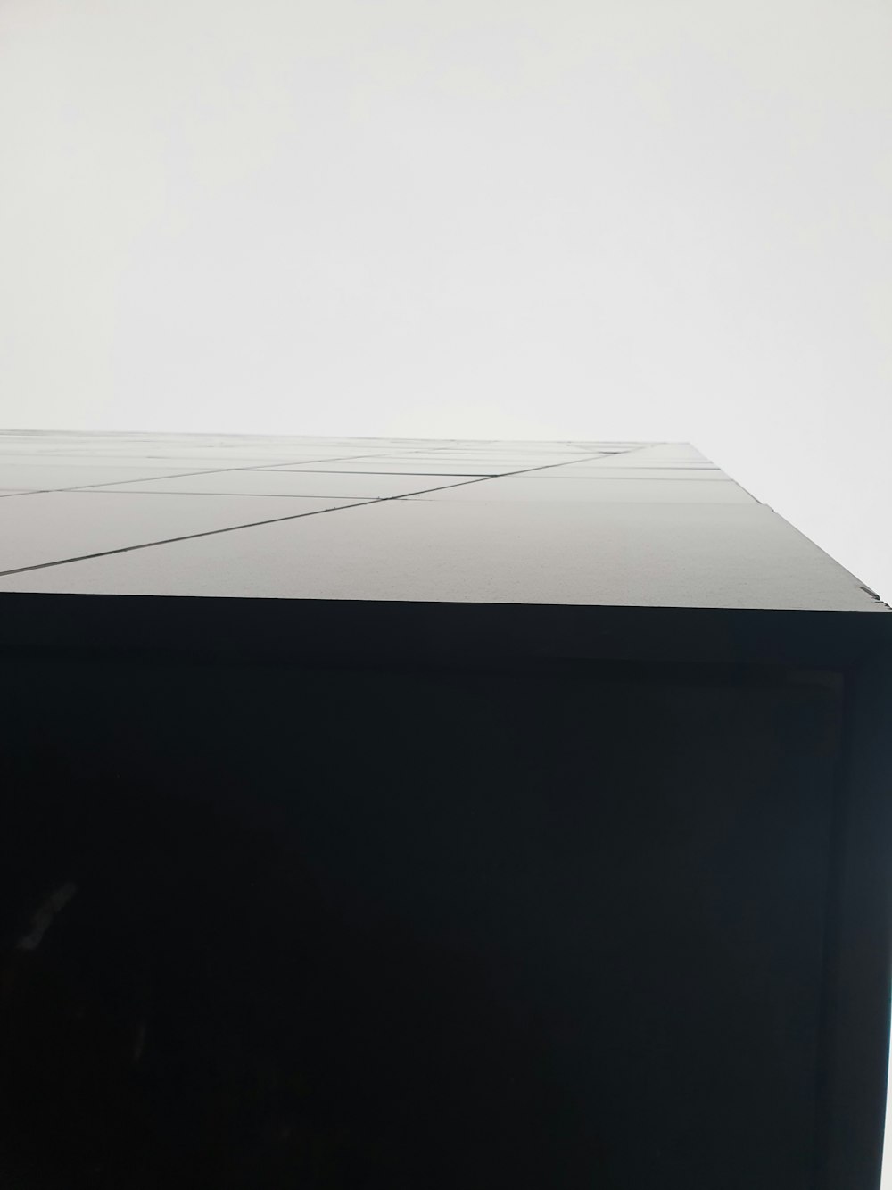 a black rectangular object with a white line across the top
