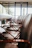 Modern office setting with multiple Aero Chairs around a conference table, sunlight streaming in.