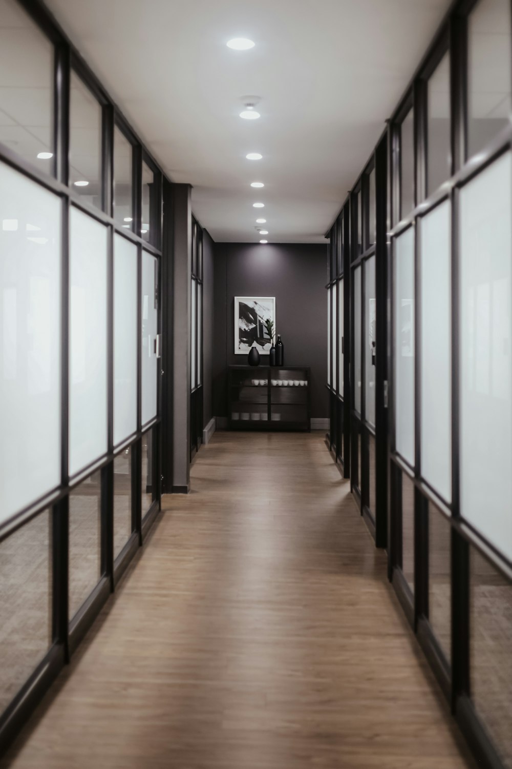 a hallway with black and white walls