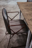 Elegant gray interlocutor chair highlighted in a stylish office corner.
