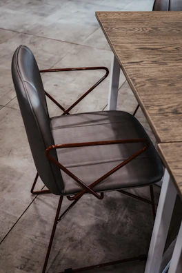 Elegant gray interlocutor chair highlighted in a stylish office corner.