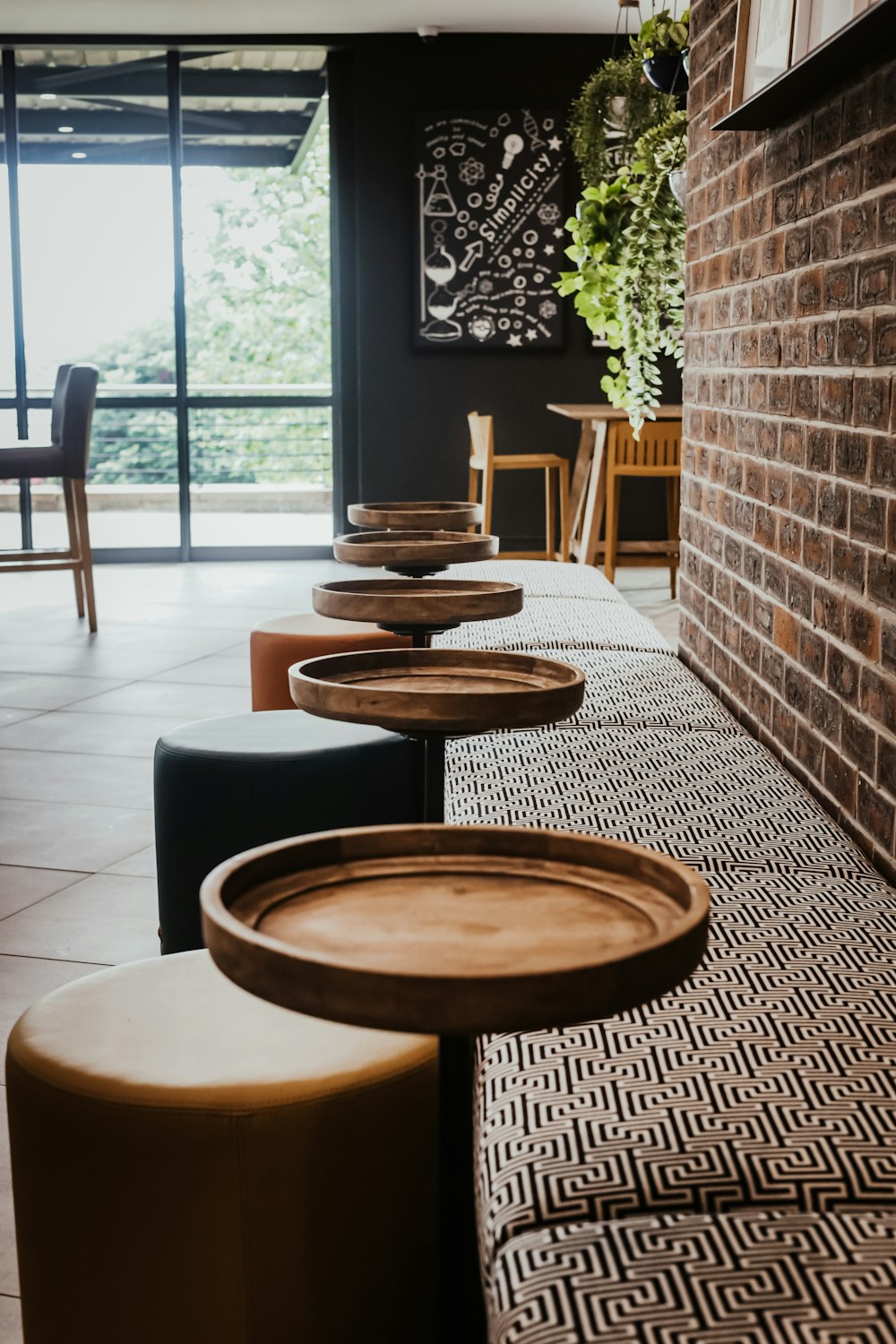 a group of stools in a room with a window