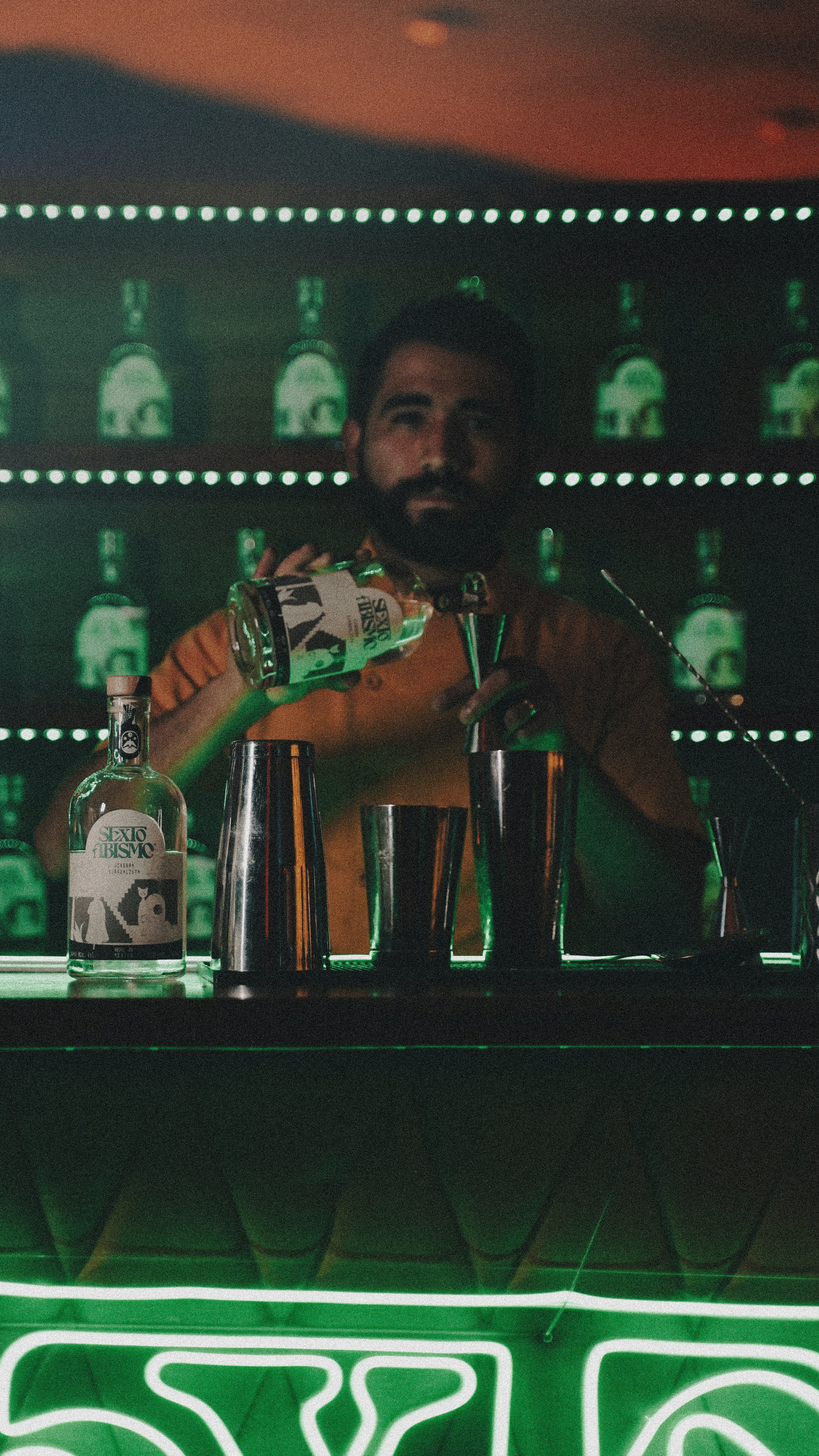 a man holding a bottle of alcohol