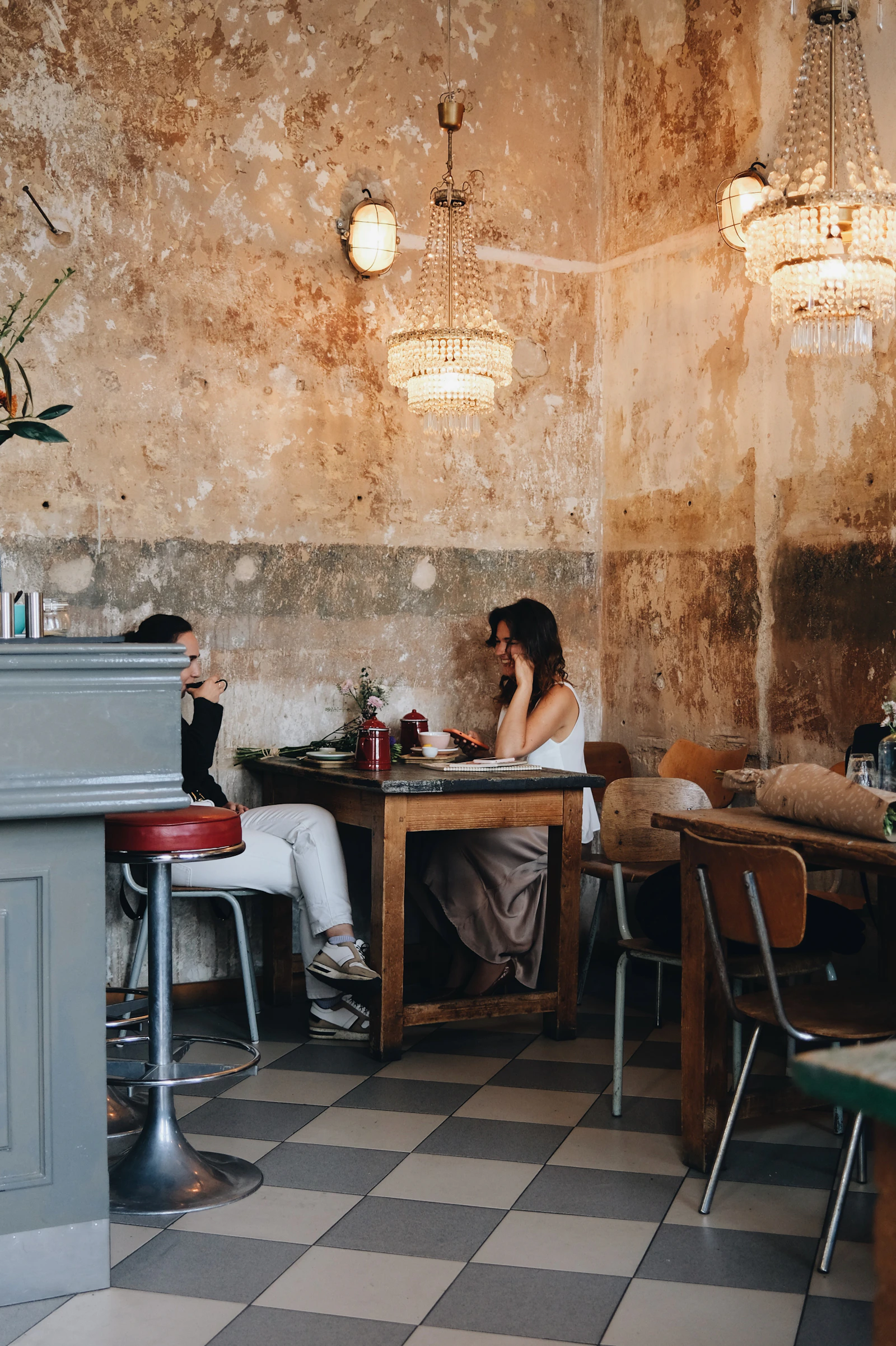 Two people talking over coffee on a relaxed first date after a long relationship