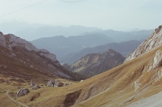 A serene mountain landscape with a winding trail.