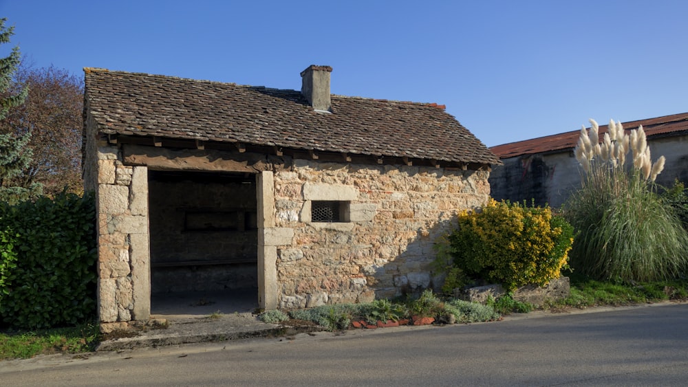 a stone building with a garage