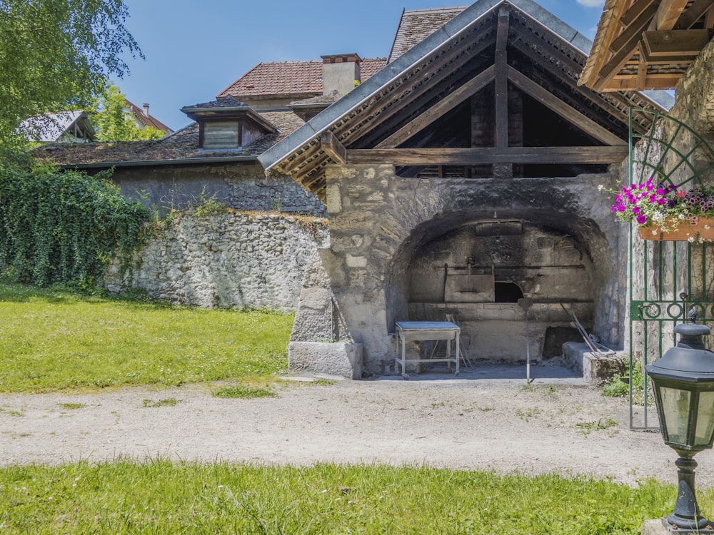 a stone building with a fireplace