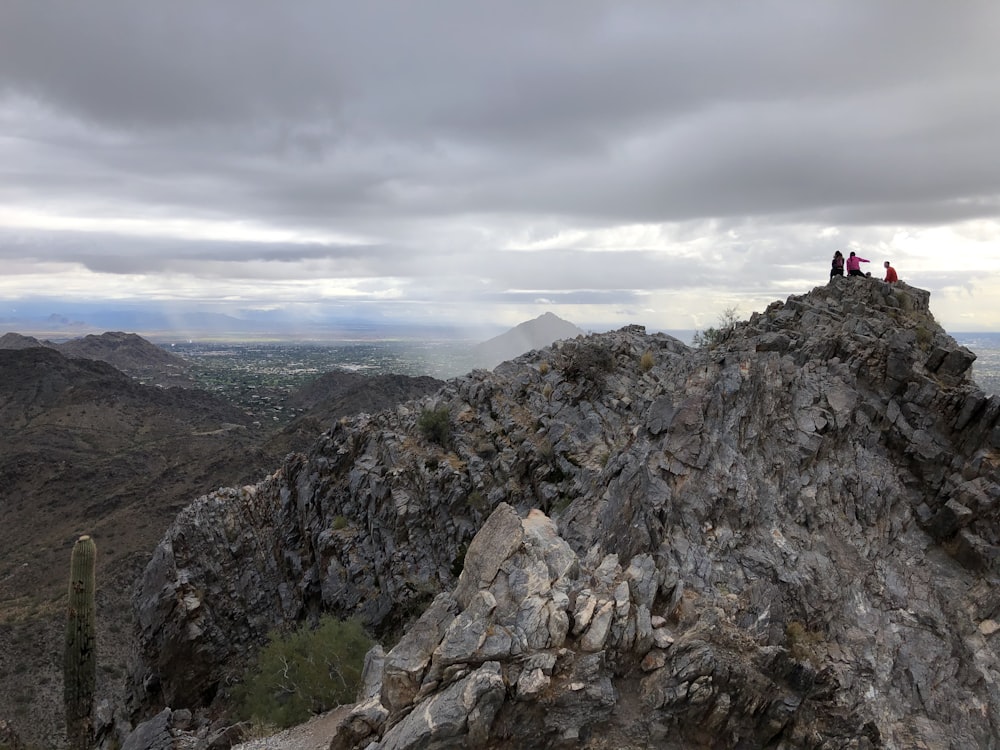 a group of people on a rocky mountain