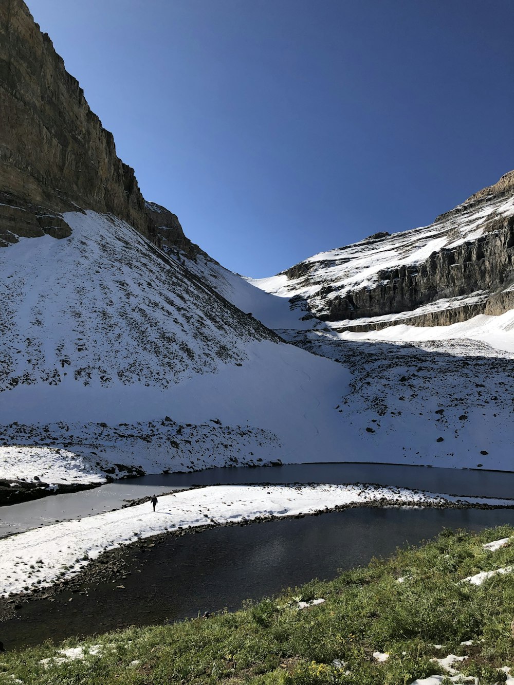 a river running through a snowy mountainous region