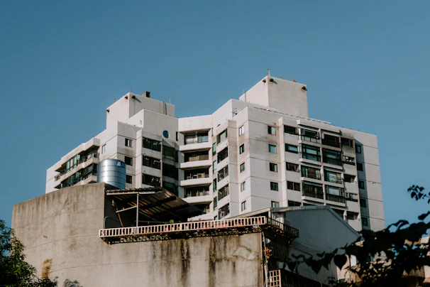 High-rise apartment complex with a premium stainless steel fire water tank positioned on the rooftop.