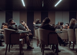 a group of people sitting at tables