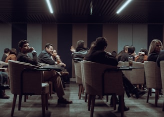 a group of people sitting at tables