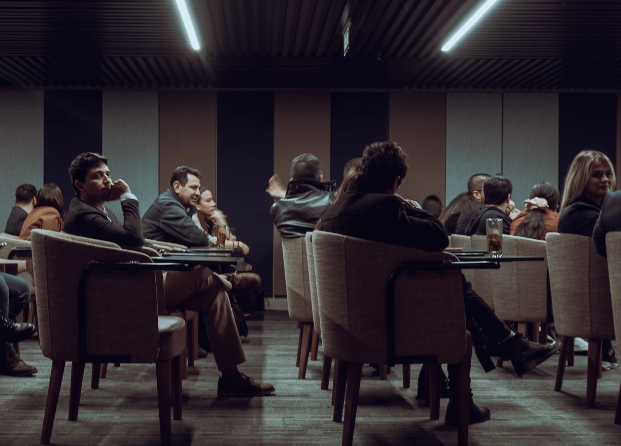 a group of people sitting at tables