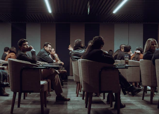 a group of people sitting at tables
