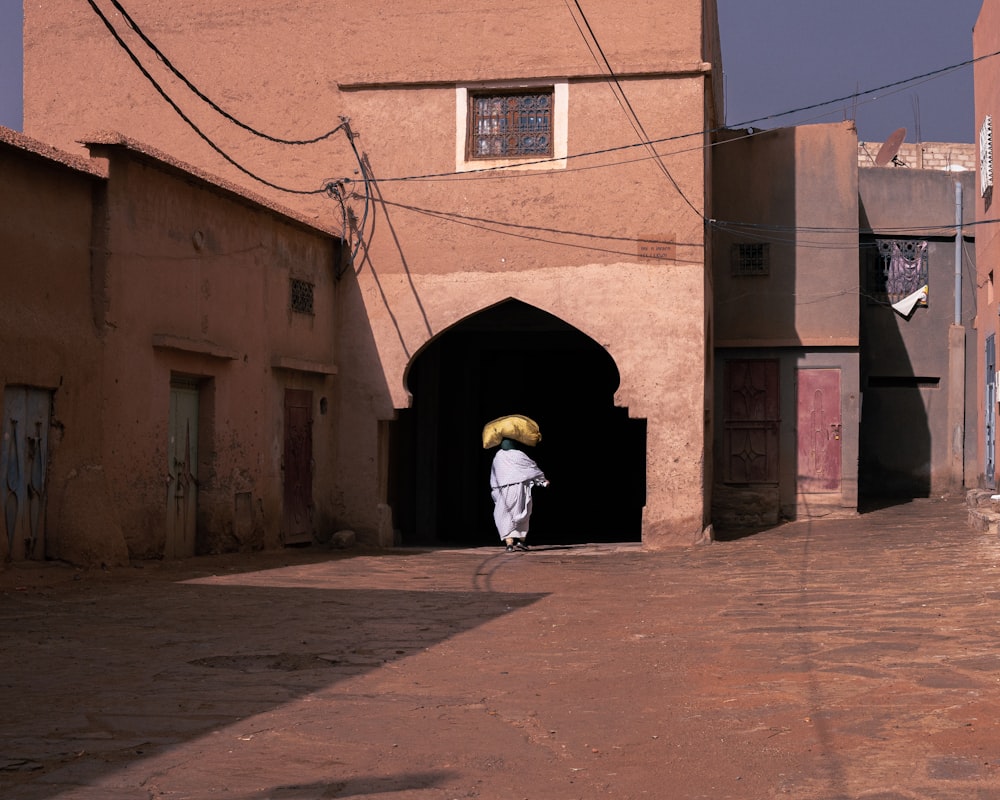 a person walking through a tunnel