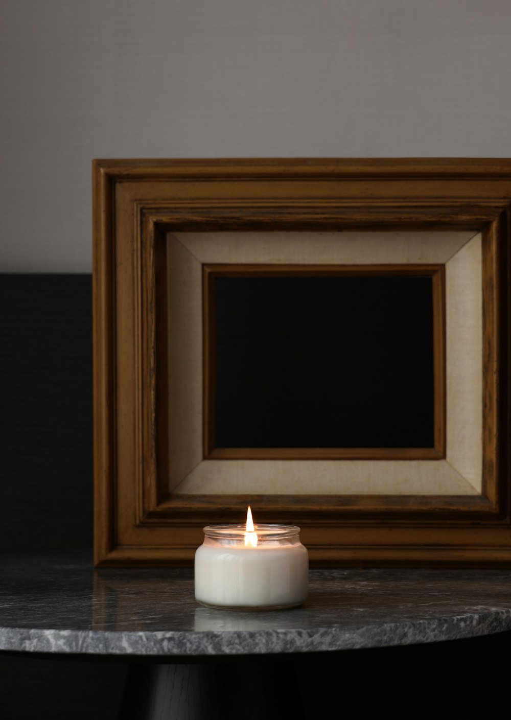 a candle in a frame