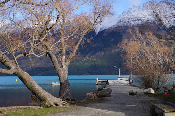 A lakeside path near Glenorchy with mountains behind