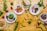 A vibrant plate of colorful, healthy dishes arranged beautifully on a wooden table.