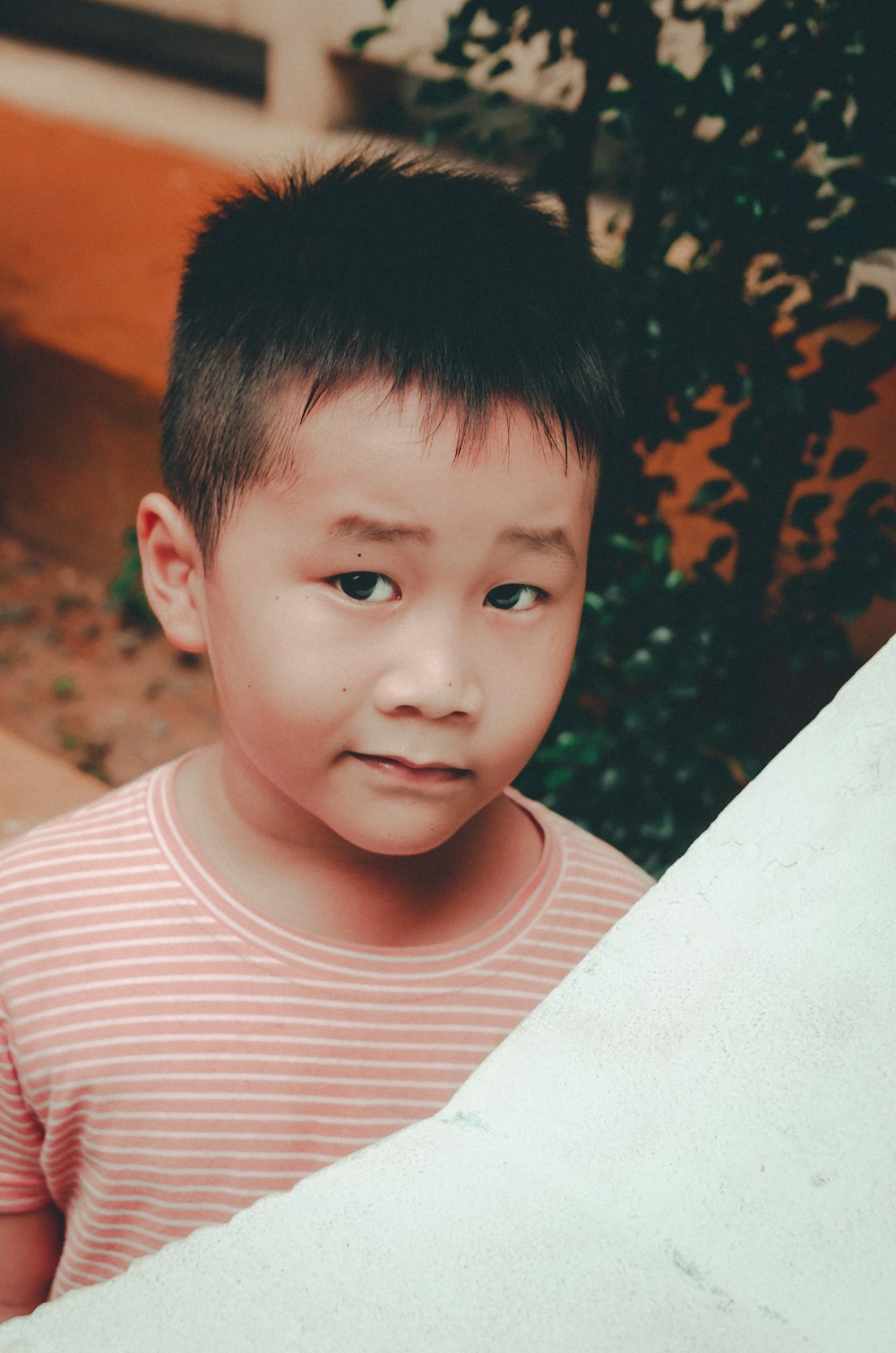 a boy looking at the camera