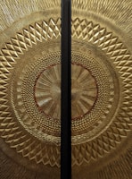 An elegant yantra design illuminated with gold accents.