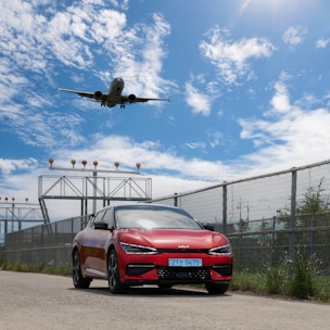a helicopter flying over a car