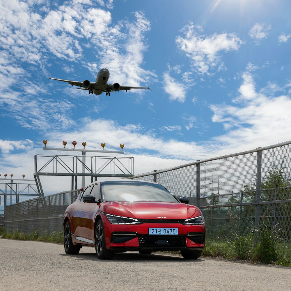 a helicopter flying over a car