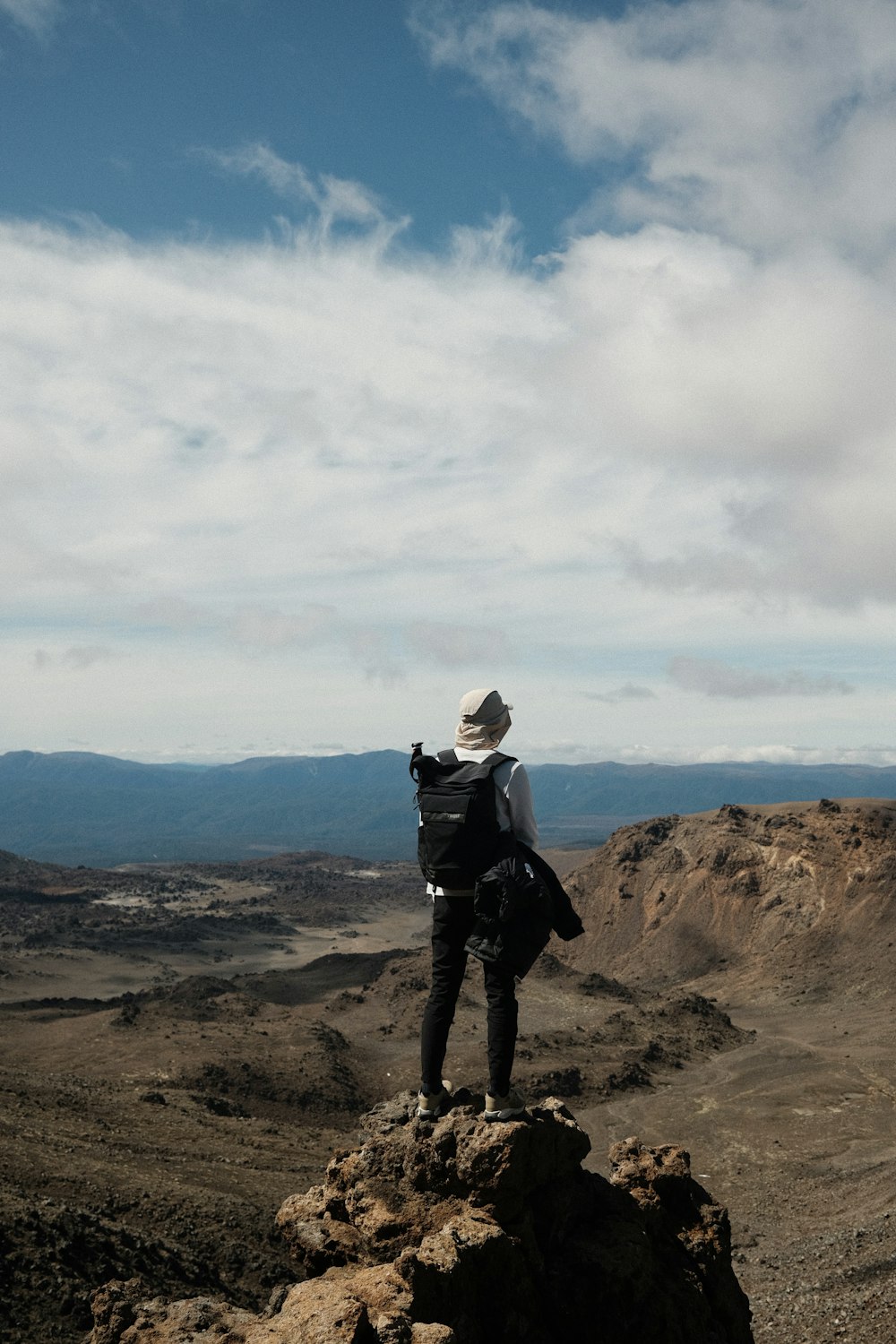 a person standing on a rock