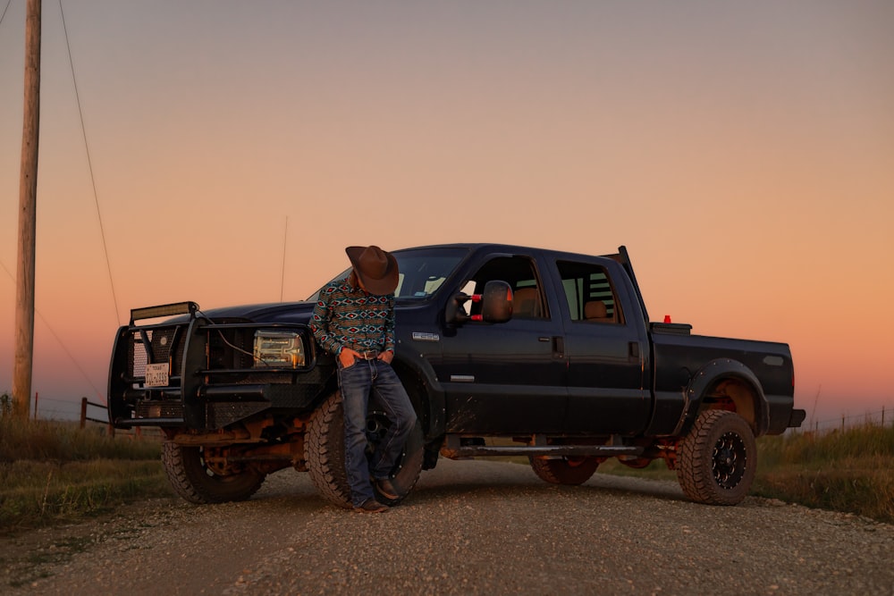 a person standing on the back of a truck