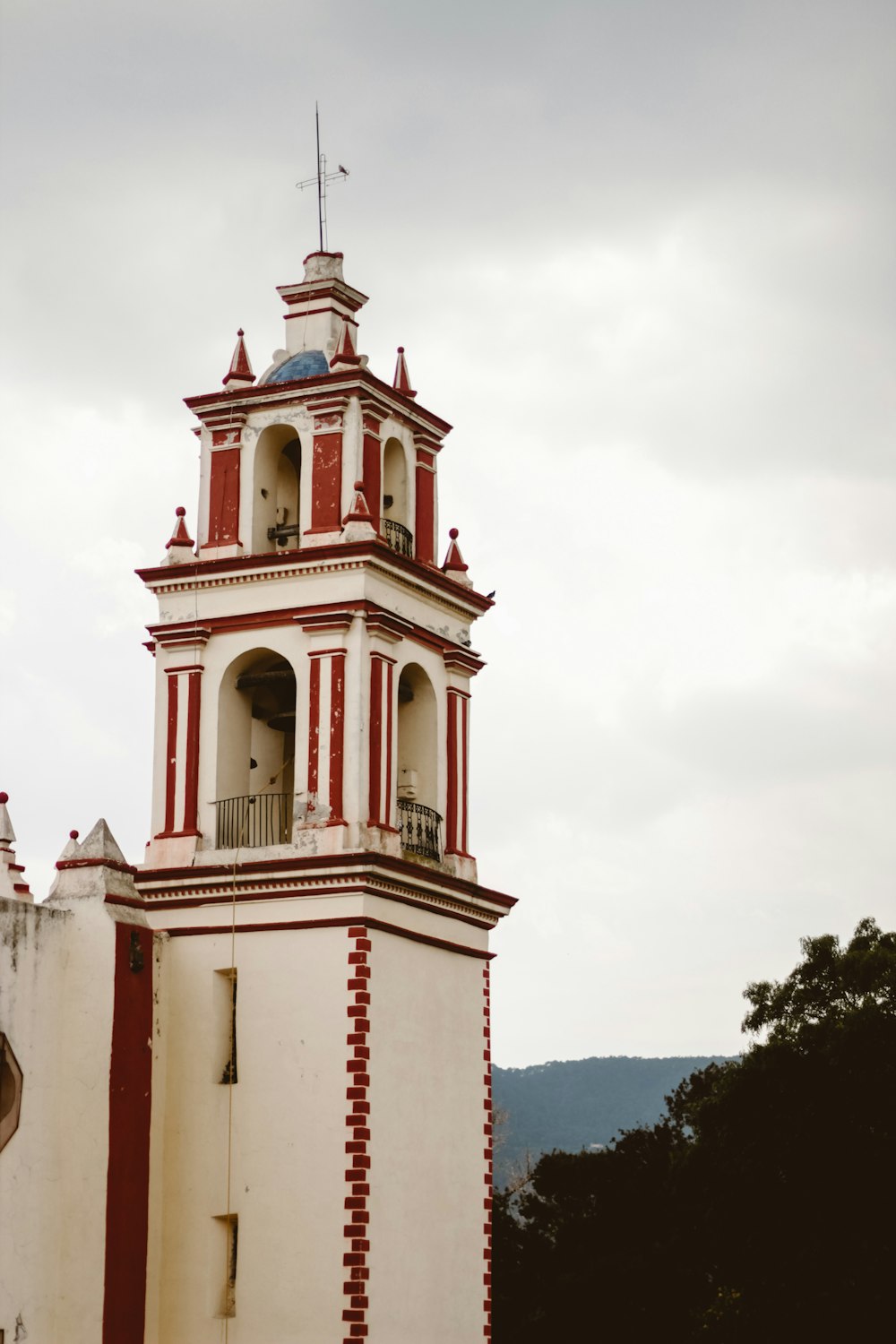 a white building with red pillars