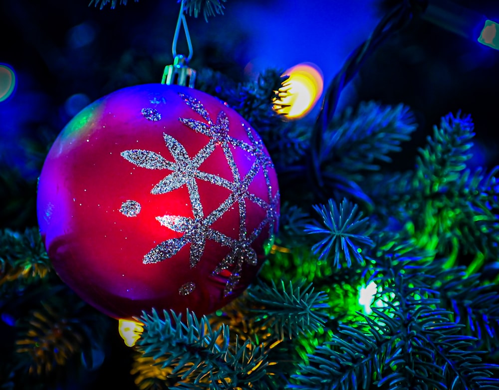 a red christmas tree with lights