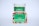 A white container with a green label for 'Carnation Organic Aloe Vera Gel' is placed on top of a colorful box featuring images of various fruits and flowers.