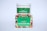 A white container with a green label for 'Carnation Organic Aloe Vera Gel' is placed on top of a colorful box featuring images of various fruits and flowers.