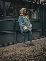 A cozy outfit featuring a soft sweater paired with comfortable boots on a mannequin.