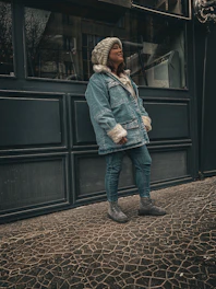 A cozy, stylish model wearing a velora premium tracksuit outdoors on a crisp morning.