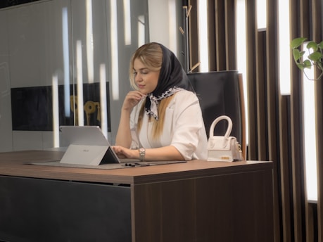 a woman sitting at a desk
