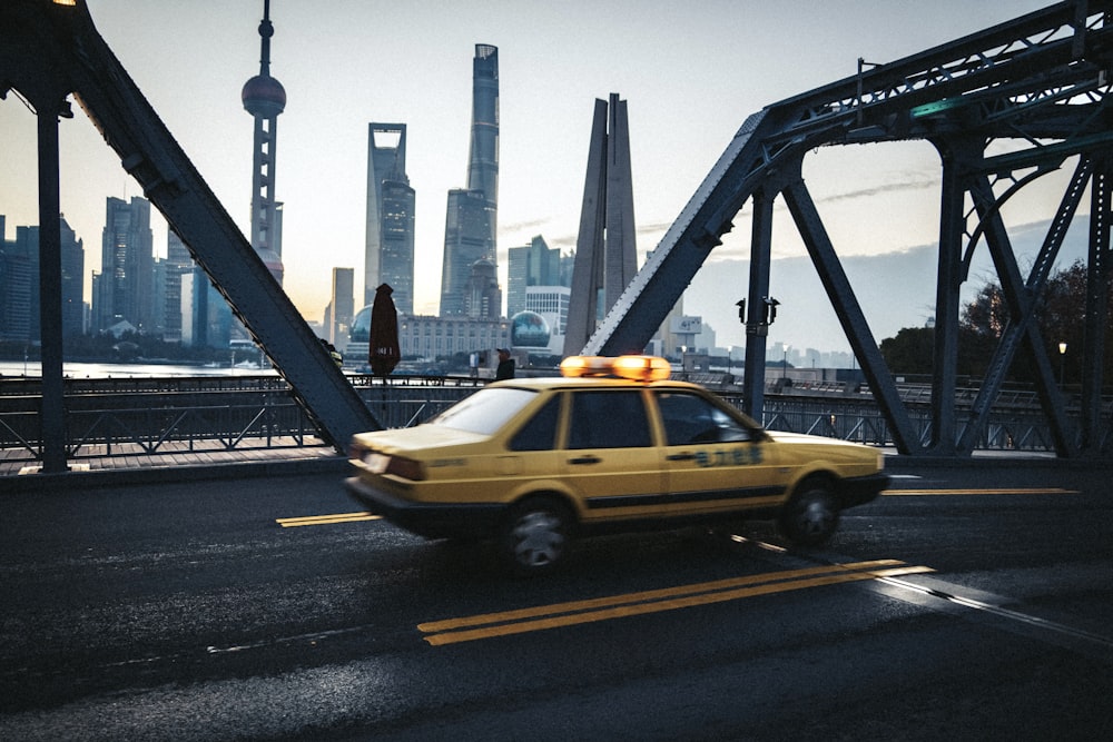 a yellow taxi on a road