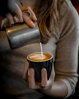 a person drinking from a cup