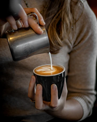 a person drinking from a cup