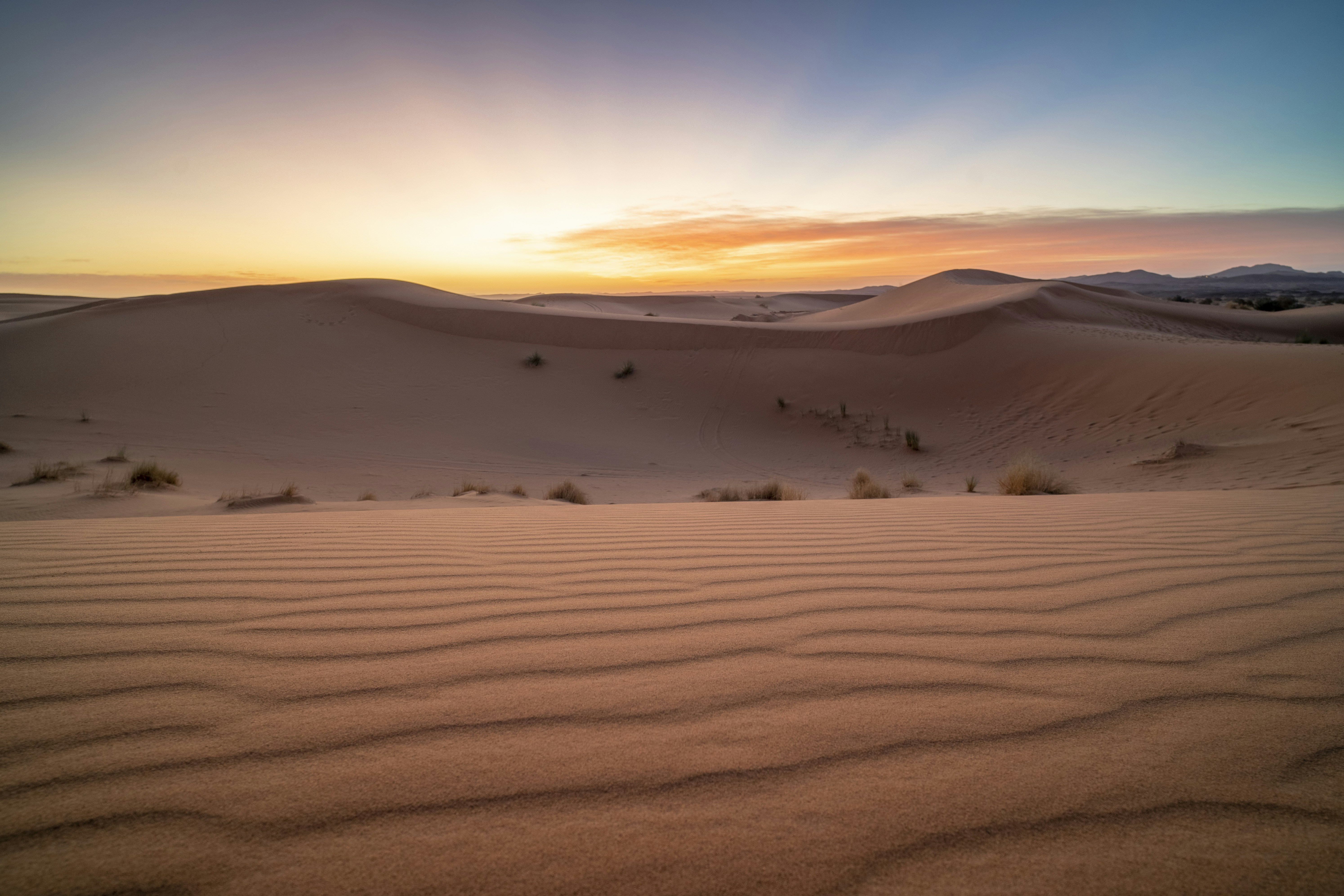 A desert landscape with sand dunes