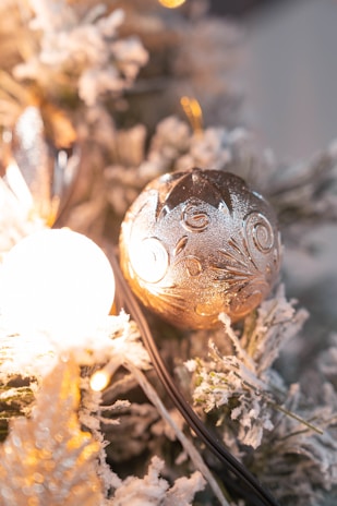 Close-up of a Christmas card with shimmering gold foil reindeer and delicate 3D snowflakes.