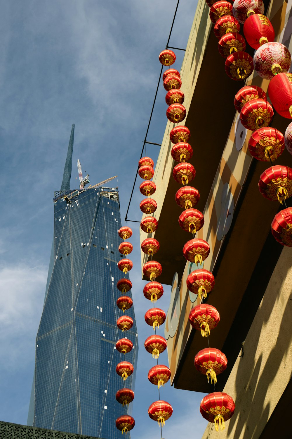 a tall building with lanterns from it