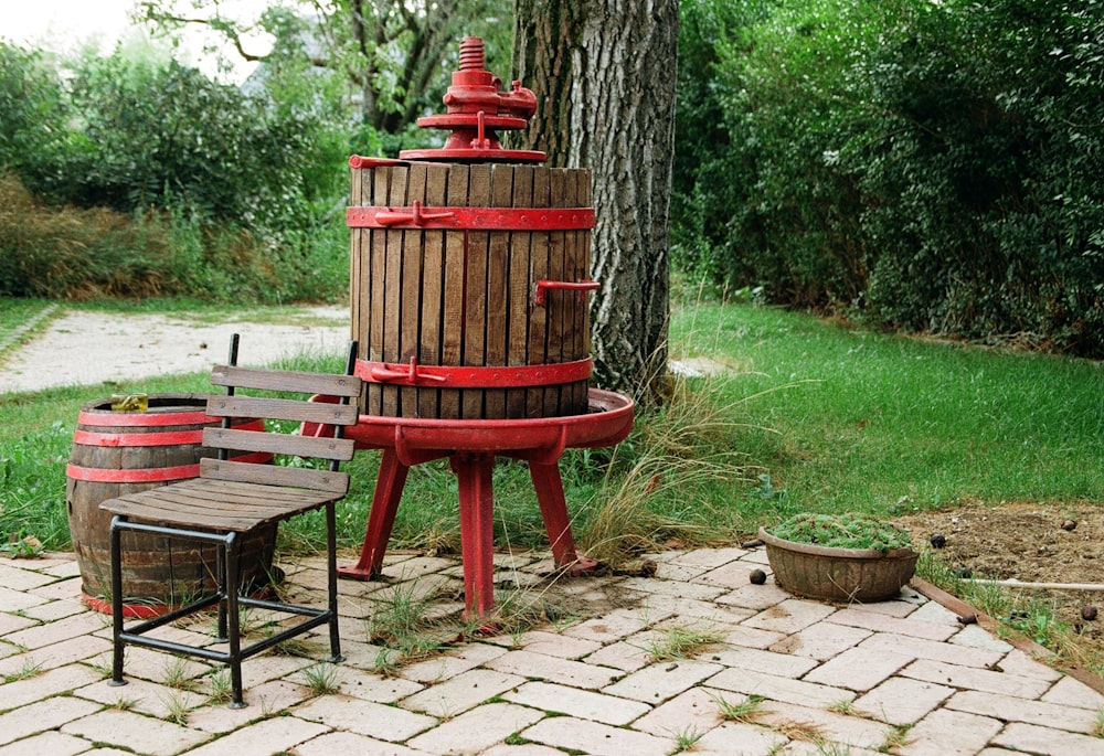 a red fire hydrant next to a bench