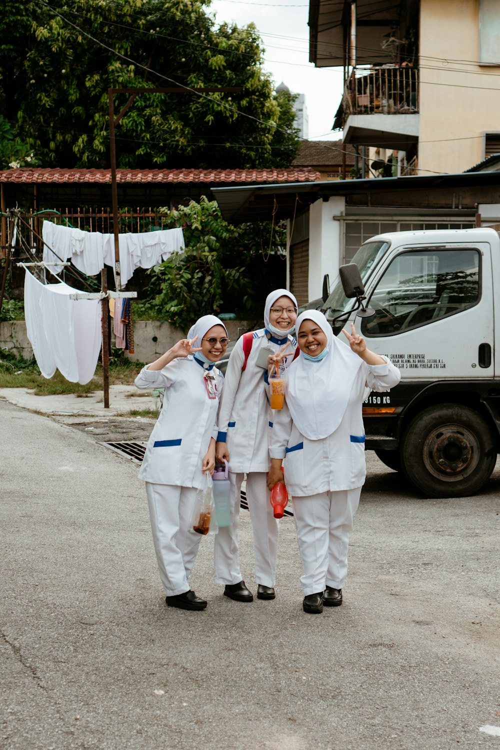 a group of people in white robes