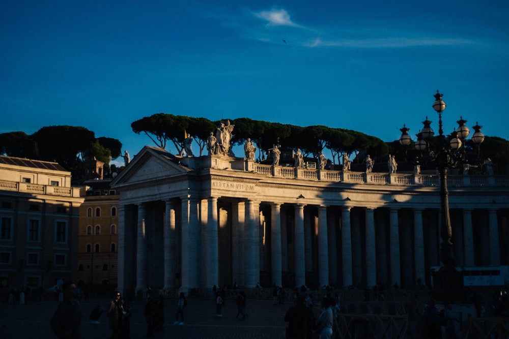 a large building with columns and statues