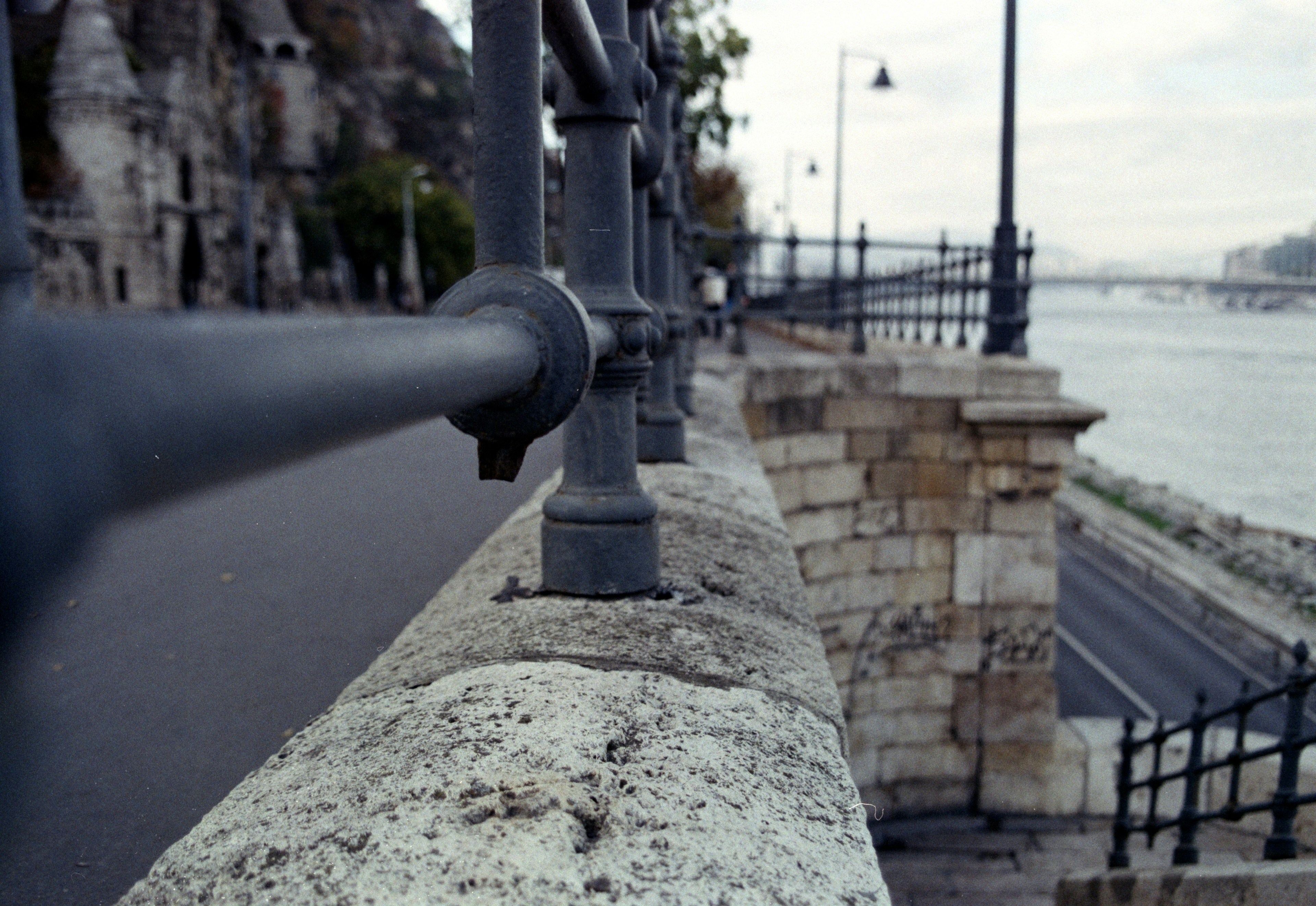 a stone wall with a stone walkway and a stone wall with a stone wall and a stone walkway