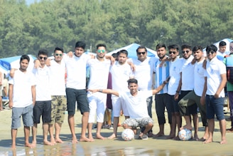 a group of men posing for a photo